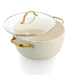 Cream-colored ceramic pot with gold handles on a white background
