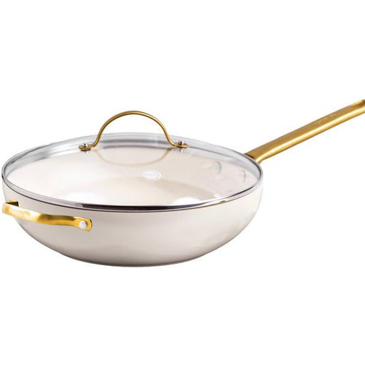 White wok with gold handle and trim on a white background