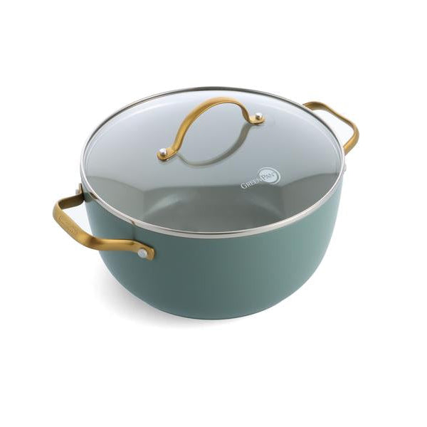 Teal cookware with gold handles on a white background