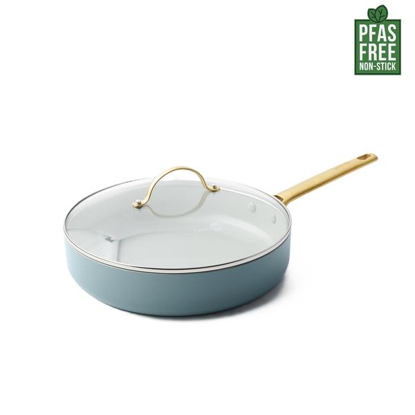 Blue ceramic cookware set with gold handle on a white background, featuring PFAS-free label.