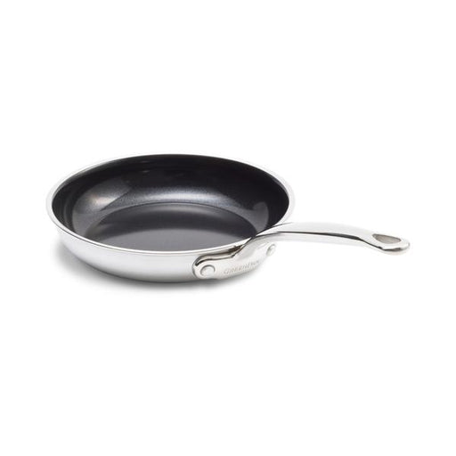 Stainless steel frying pan with a black interior on a white background