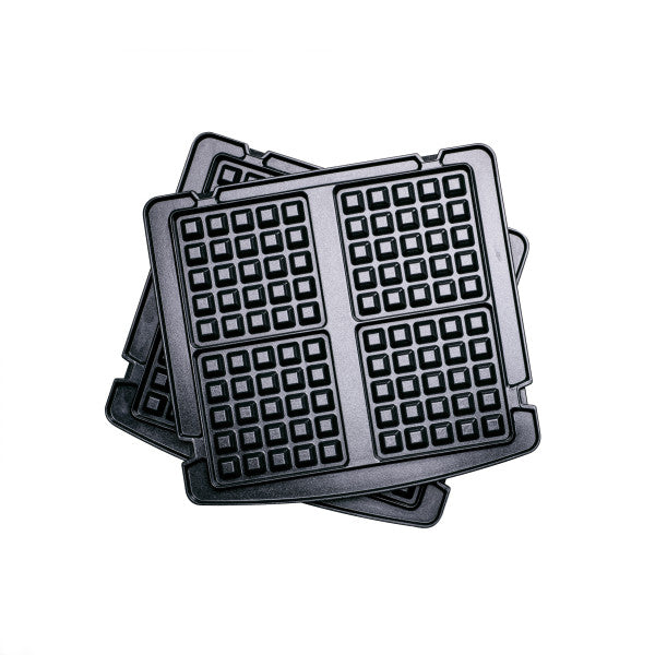 Stack of waffle iron grids on a white background