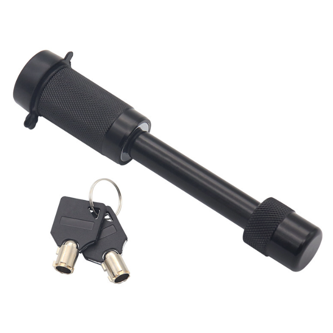 Black metal lock with key on a white background