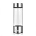A clear glass water bottle with a brushed silver metal cap and base, shown on a plain white background.