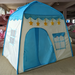 Children's play tent with blue and white design, featuring star decorations on a carpeted floor.