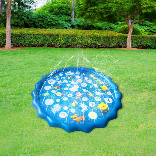 Inflatable water play mat with sprinklers on a grassy area