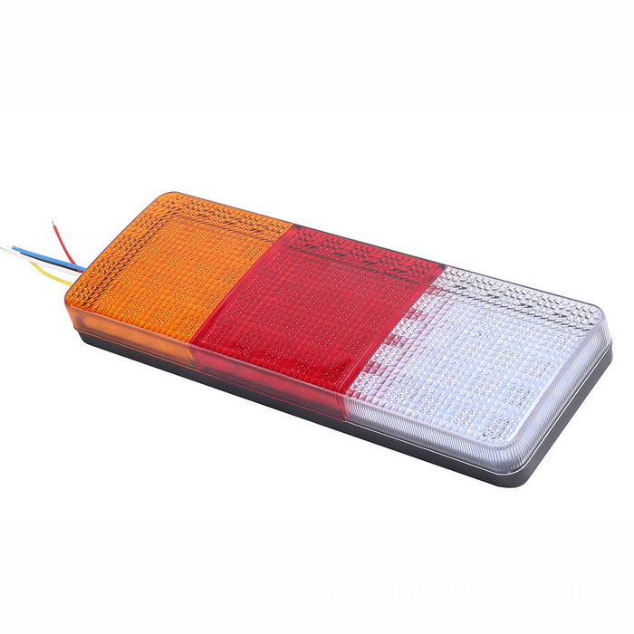Rectangular  light with orange, red, and white sections on a white background
