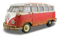 Model of a red and white vintage van on a white background
