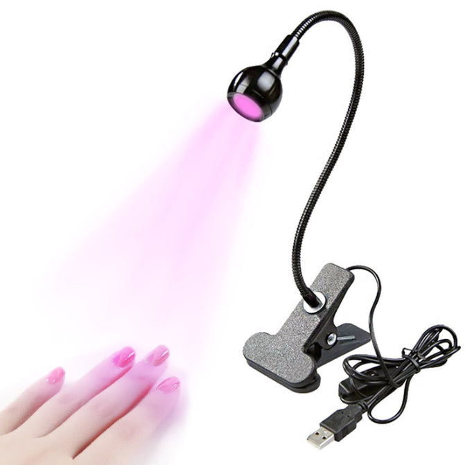 Nail lamp with USB cable on a white background