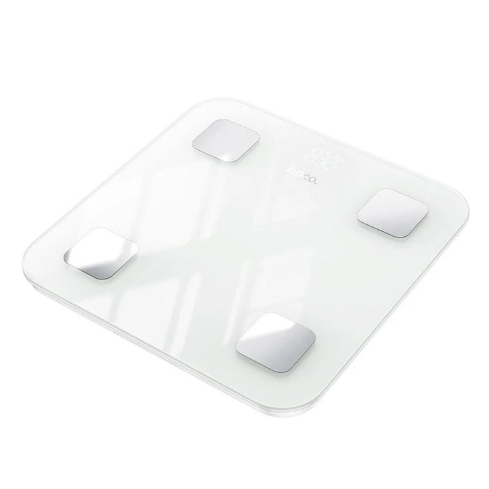 White electronic scale with four sensors on a white background