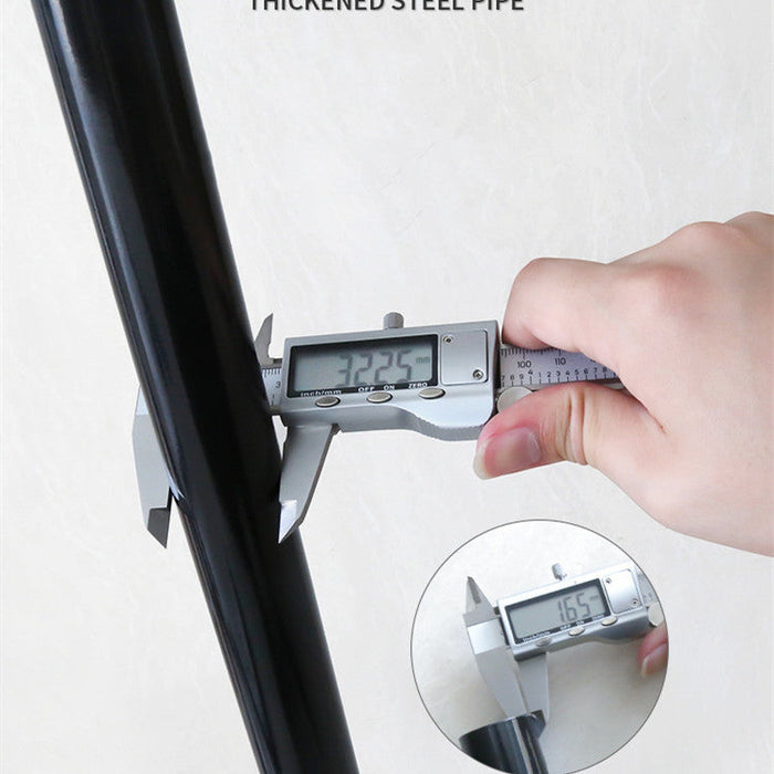 Hand using a digital caliper to measure a thickened steel pipe on a white background