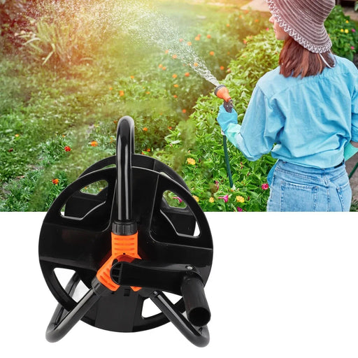 Garden hose reel with a person watering plants in the background