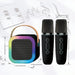 Two black microphones and a colorful portable speaker with measurements on a white background.