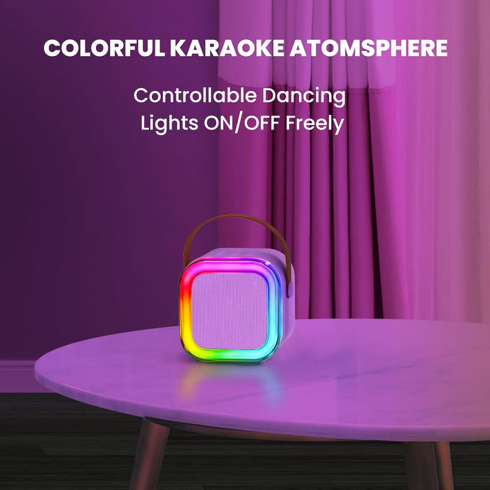 Colorful karaoke machine with RGB lights on a table against a purple curtain.
