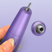 Purple nail tool held by a hand with a close-up of the tool bit on a light purple background