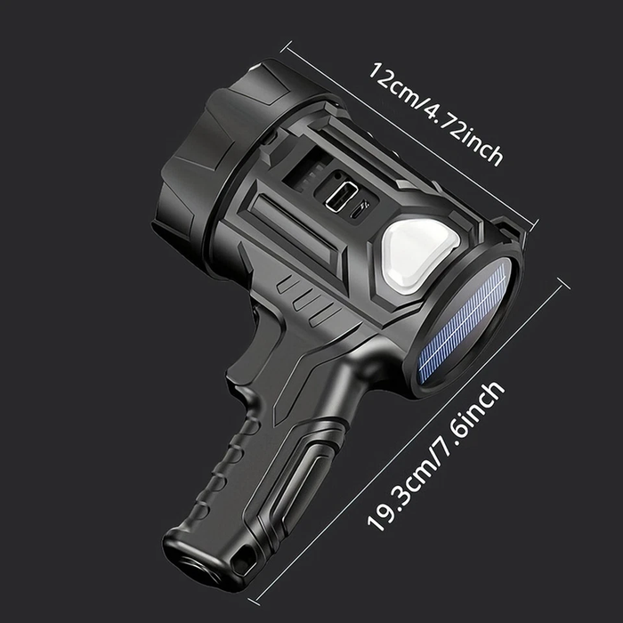 Black flashlight with measurements on a black background