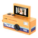 Orange mini camera with a screen displaying a woman, on a white background