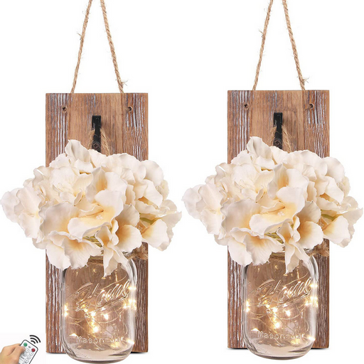 Two hanging wall sconces with floral arrangements and string lights on a white background