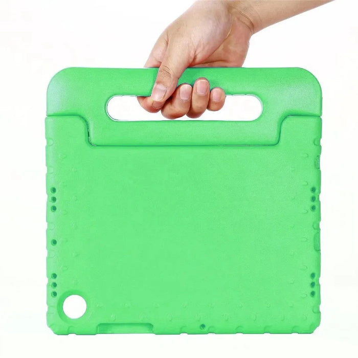 Green cutting board with handle held by a hand on a white background