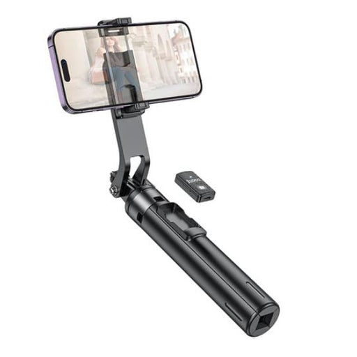 Phone holder with remote control on a white background