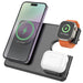 Wireless charging pad with smartphone, smartwatch, and earbuds on a white background