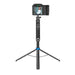 Camera on a tripod with a smartphone attached, on a white background