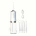 White dental water flosser with attachments on a white background