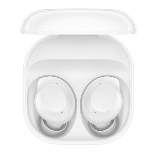 White wireless earbuds in a transparent charging case on a white background