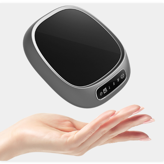 Gray USB Coffee Mug Warmer hovering above a hand on a white background