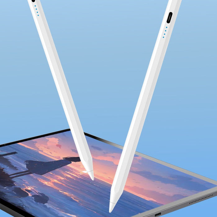 Two white styluses above a tablet displaying a sunset scene on a blue background.