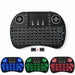 Black wireless keyboard with colorful LED backlighting on a white background