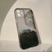 Phone case with moon and cloud design on a light background