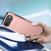 Hand holding a rose gold phone case with a blurred background