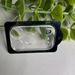Phone camera lens protector with 'IP 17 Pro' and '9H' text, surrounded by green leaves on a light gray background