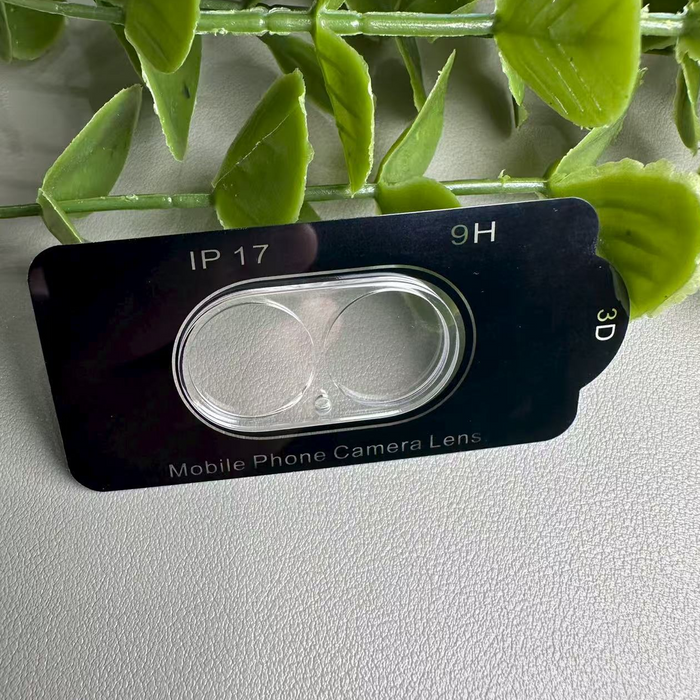 Phone camera lens protector with text on a light gray background