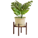 A mid-century bamboo indoor plant stand with a green potted plant on top.