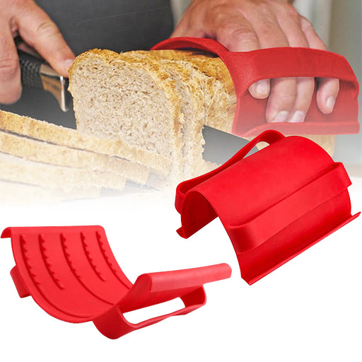 Two red silicone oven gloves with straps, one being used to hold a piece of bread, the other displayed separately.