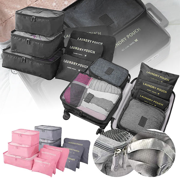 A set of travel packing cubes in various sizes, displayed in black, blue, grey, and pink colors. The cubes are shown packed with clothes and neatly arranged, illustrating their use for organizing luggage.