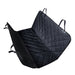 A product image of an unfolded black, quilted, waterproof car seat cover for pets. The cover is shaped like a hammock for a bench seat, featuring adjustable straps and buckle closures on the corners for attachment.