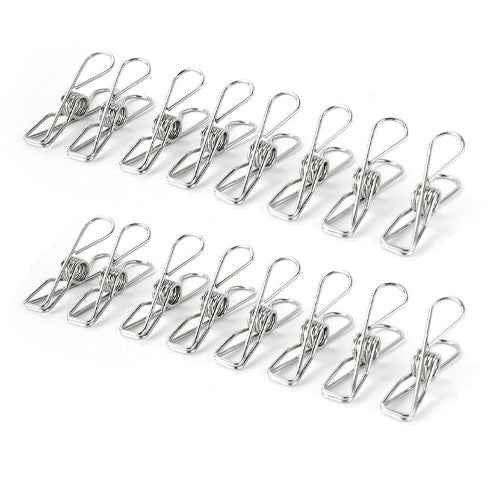 
A simple product image showing sixteen stainless steel mini spring clips (or clothes pegs) arranged in two parallel rows of eight, viewed at a slight angle on a white surface.