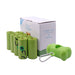 Eco-friendly pet waste bags set with eight green refill rolls, a box, and a bone-shaped dispenser with a carabiner.