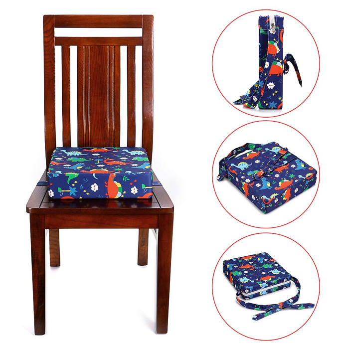 A highchair booster cushion with a blue dinosaur pattern placed on a wooden chair. Additional images show the cushion folded and tied with straps, indicating its portability and dismountable features.