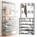 A multifunctional coat, hat, and shoe rack with multiple shelves and hooks, in black color.