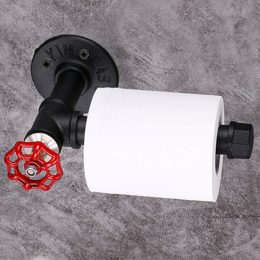 A vintage style toilet paper holder with a black matte finish and a red flange, mounted on a wall.
