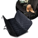 A composite product image featuring a black, quilted, waterproof car seat cover for pets. The large foreground image shows the cover unfolded flat. An inset circle in the upper right shows the cover installed on a car seat, acting as a seat protector, with a small, happy dog sitting on it.