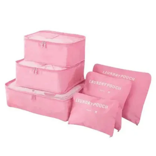 A complete set of three stacked pink mesh-top packing cubes and three matching flat "LAUNDRY POUCH" bags is displayed, showing a full luggage organizer set.