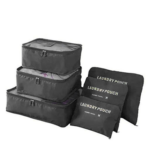 A complete set of three stacked black mesh-top packing cubes and three matching flat "LAUNDRY POUCH" bags is displayed against a white background.