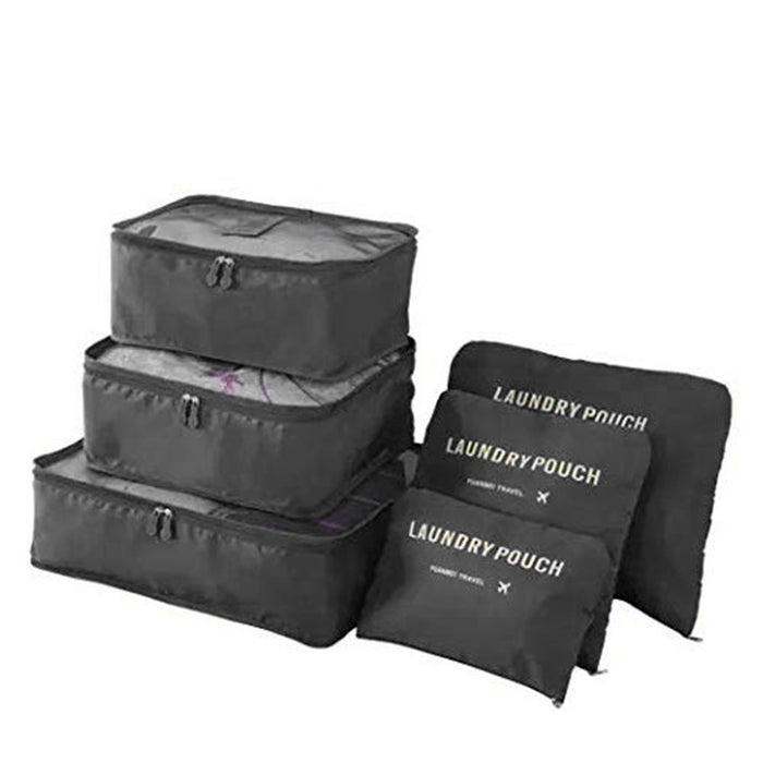 A complete set of three stacked black mesh-top packing cubes and three matching flat "LAUNDRY POUCH" bags is displayed against a white background.