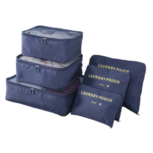 A complete set of three stacked dark blue mesh-top packing cubes and three matching flat "LAUNDRY POUCH" bags with gold labeling is displayed against a white background.